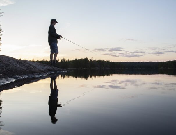 Man fishing on Cox Lake. Photographer: Whitney ArnottSummer 2021